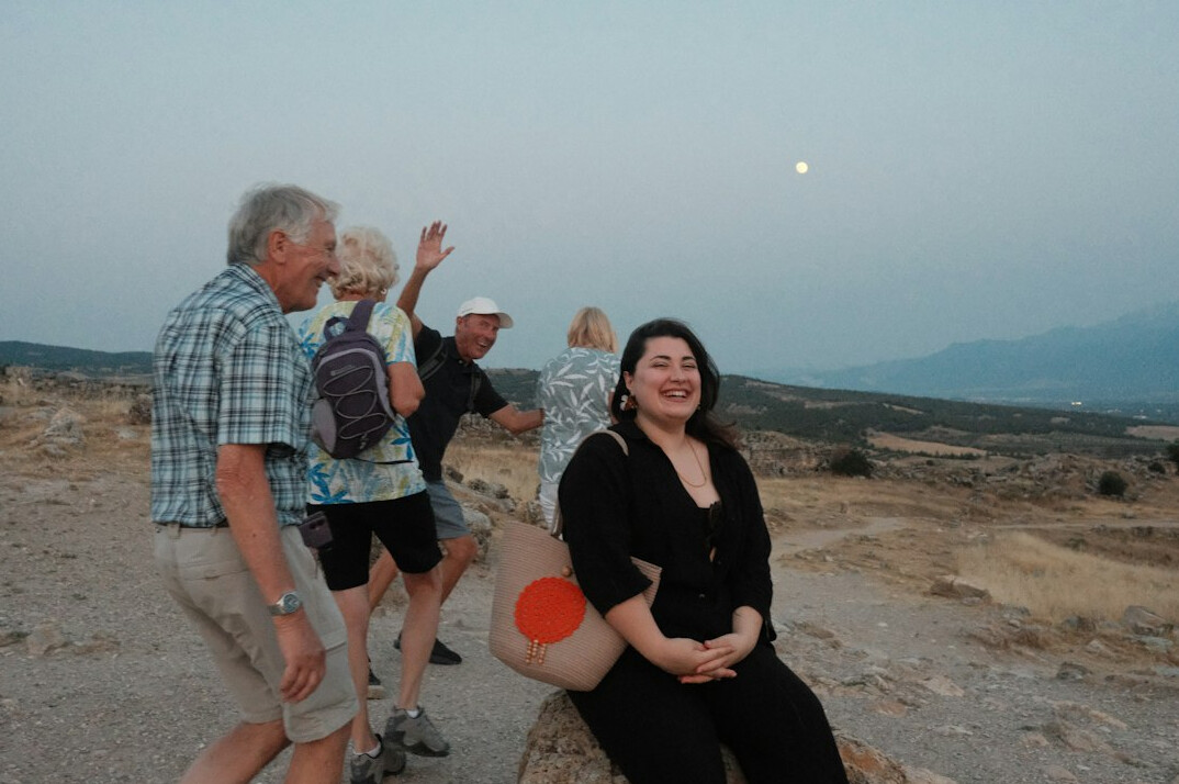 Group of active older adults laughing together outdoors
