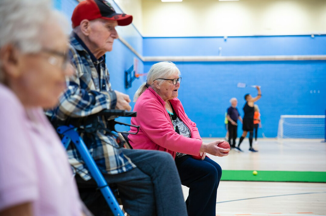 elderly people chatting in community center